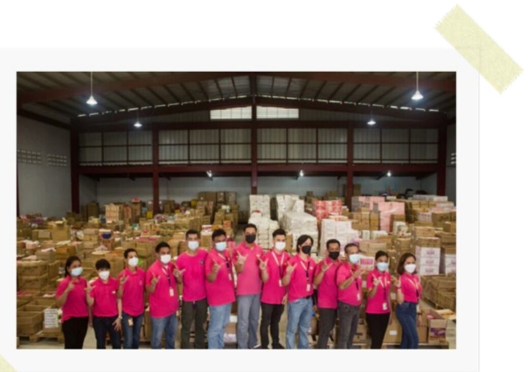 The Vanity Connections team in front of warehouse stock